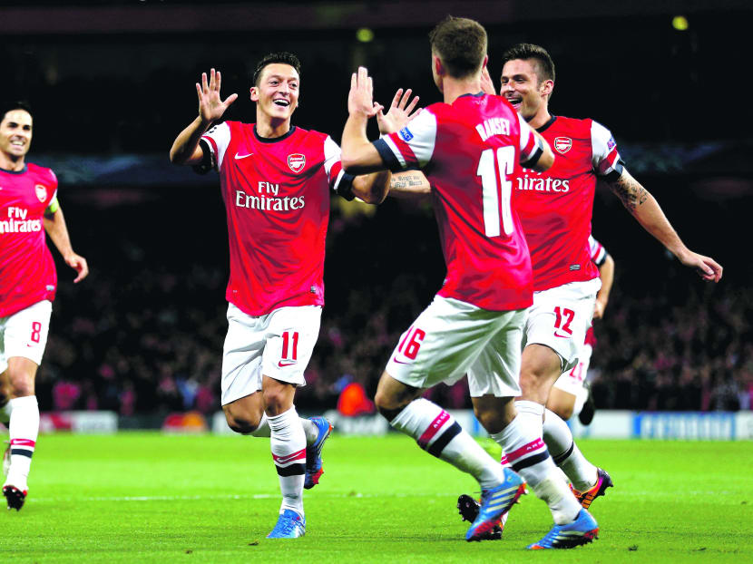 The presence of Ozil (centre) has undeniably lifted Arsenal to a higher plain. Photo: Getty Images