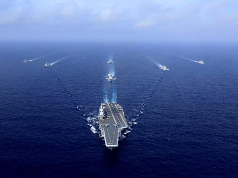 This file photo taken on April 18, 2018 shows China's aircraft carrier, the Liaoning (centre), sailing during a drill at sea. China's accelerated military modernisation poses a clear and growing threat to Taiwan, and US intervention might only risk intensifying pressure from Beijing, US defence officials told reporters on March 15, 2021. This file photo taken on April 18, 2018 shows China's aircraft carrier, the Liaoning (centre), sailing during a drill at sea. China's accelerated military modernisation poses a clear and growing threat to Taiwan, and US intervention might only risk intensifying pressure from Beijing, US defence officials told reporters on March 15, 2021.