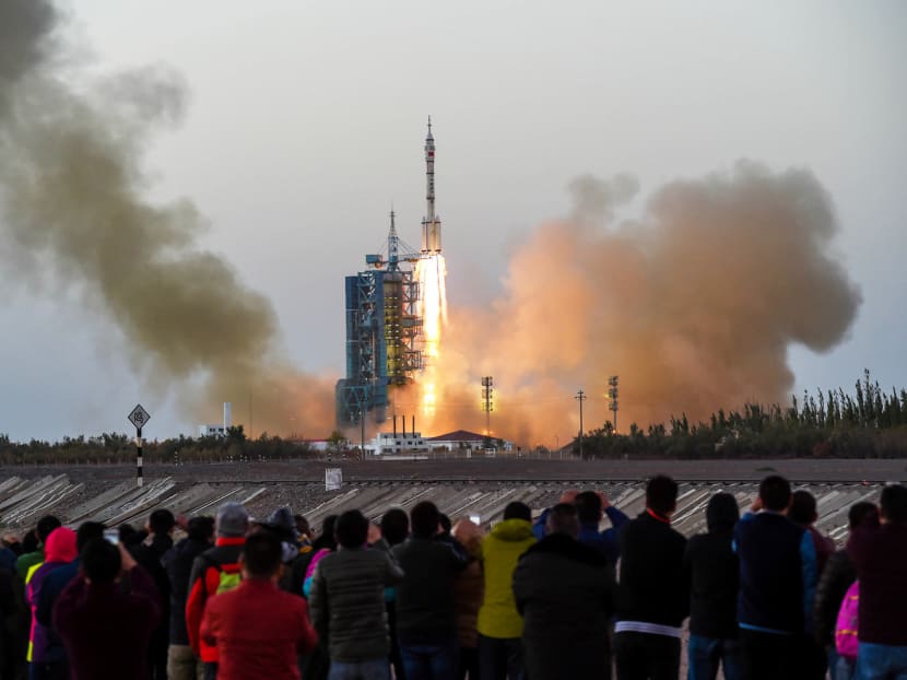 Visitors watching the Shenzhou 11 manned spacecraft carrying astronauts Jing Haipeng and Chen Dong blast off in Jiuquan last month. Photo: Reuters