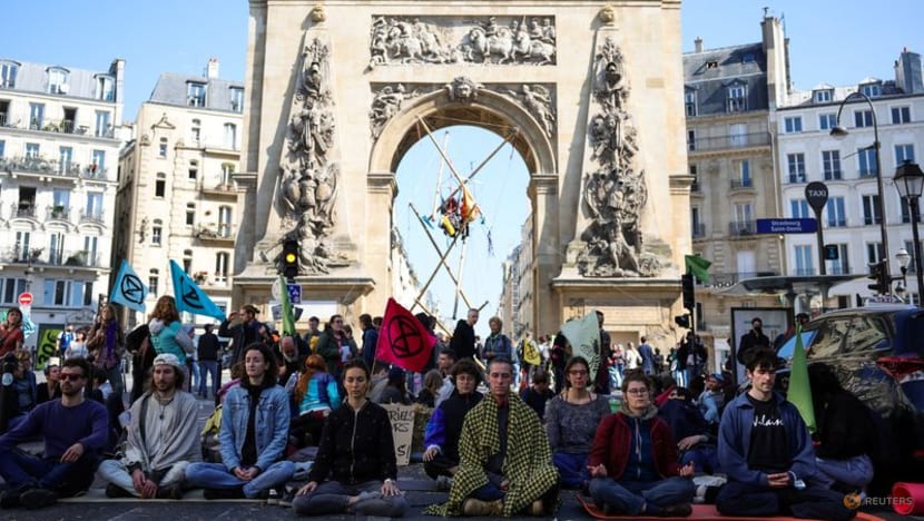 Climate change protesters block central Paris square in objection to election choices