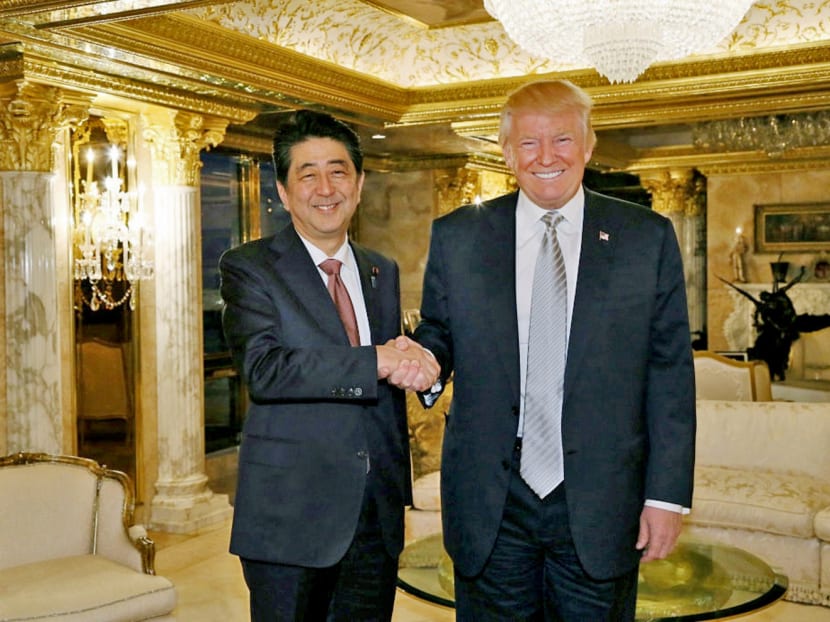 Japan's Prime Minister Shinzo Abe meets with US President-elect Donald Trump at Trump Tower in Manhattan, New York on November 17, 2016. Photo: Cabinet Public Relations Office/handout via Reuters