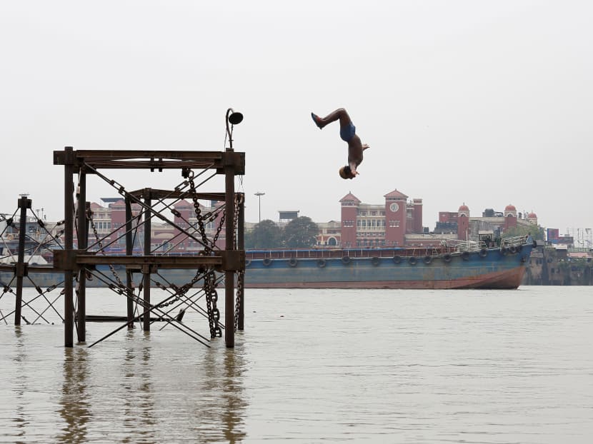Photo of the day: A boy jumps into the Ganges river to cool off on a hot summer day in Kolkata, India, on Monday, June 3, 2019. Photo: Reuters