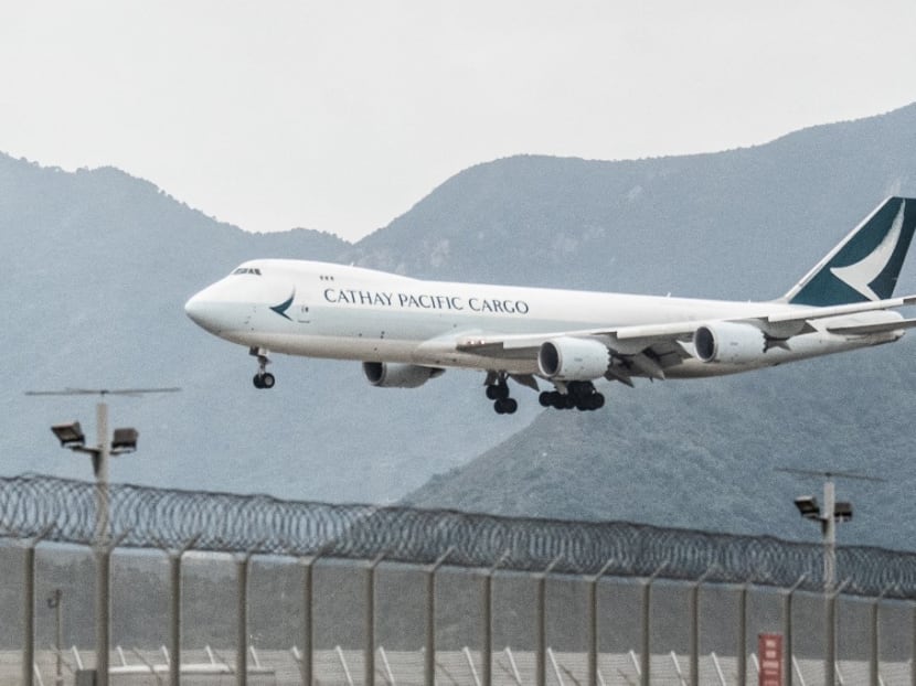 A Cathay Pacific cargo airplane prepares to land at Hong Kong International Airport on Nov 21, 2021.