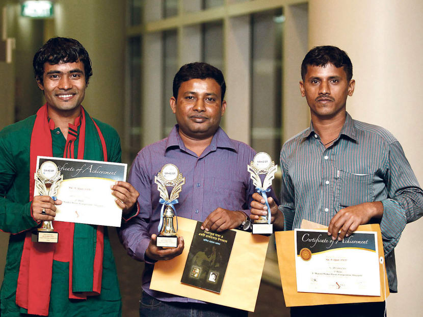 The top three winners of the poetry competition (from left) Mr Rajib Shil Jibon (second place), Mr Zakir Hussain Khokhon (first place) and N Rengarajan. Photo: Wee Teck Hian