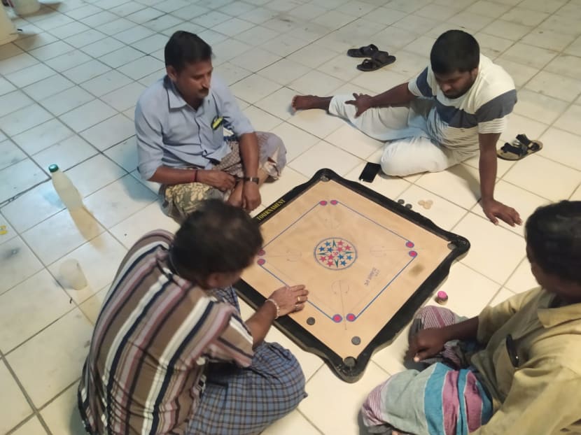 Site supervisor Mr Billal Khan (not in picture) and his roommates have been passing time in their dormitory by playing games such as carrom.