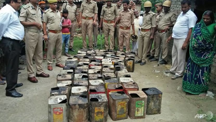 At least 99 dead after consuming toxic alcohol in India At least 99 dead after consuming toxic alcohol in India