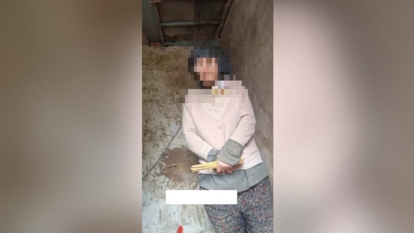 Six people in China jailed after woman was seen in video chained by the neck