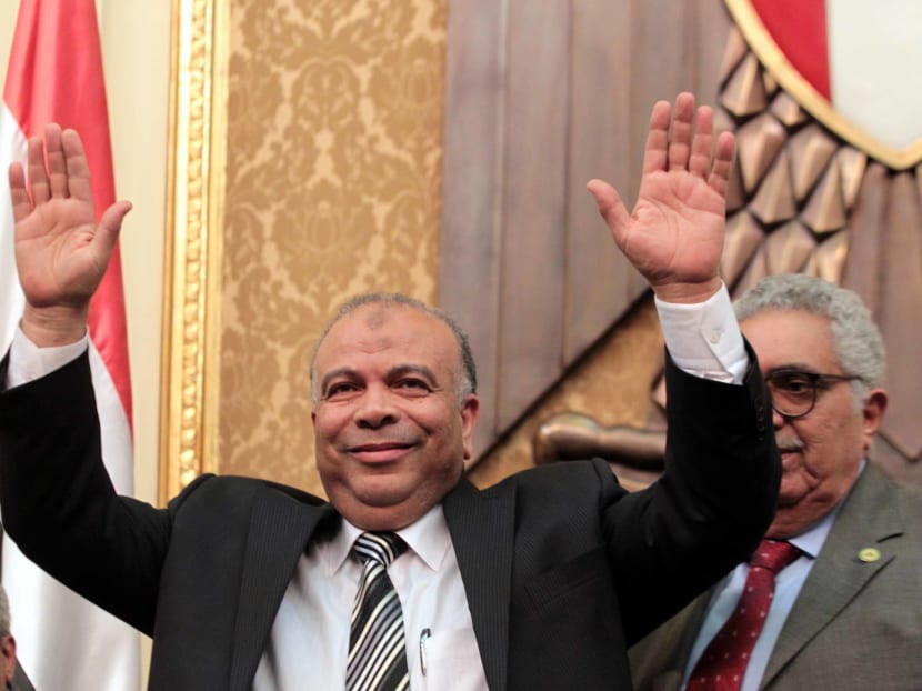 File photo of Saad el-Katatni, Egypt's newly-elected parliament speaker gestures during the first session after the revolution that ousted former President Hosni Mubarak, in Cairo, Egypt. Photo: AP
