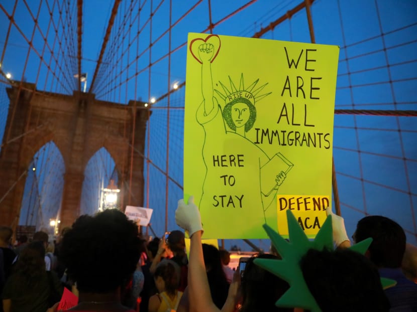 Fear has spiked in American society that Mr Trump's immigration policies might accentuate racial politics and marginalise the minorities. Photo: Reuters