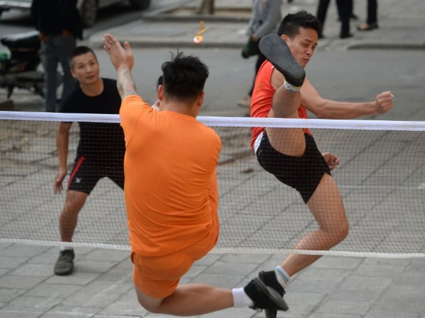 Da Cau, or foot badminton in Vietnamese, players in Hanoi. Photo: AFP