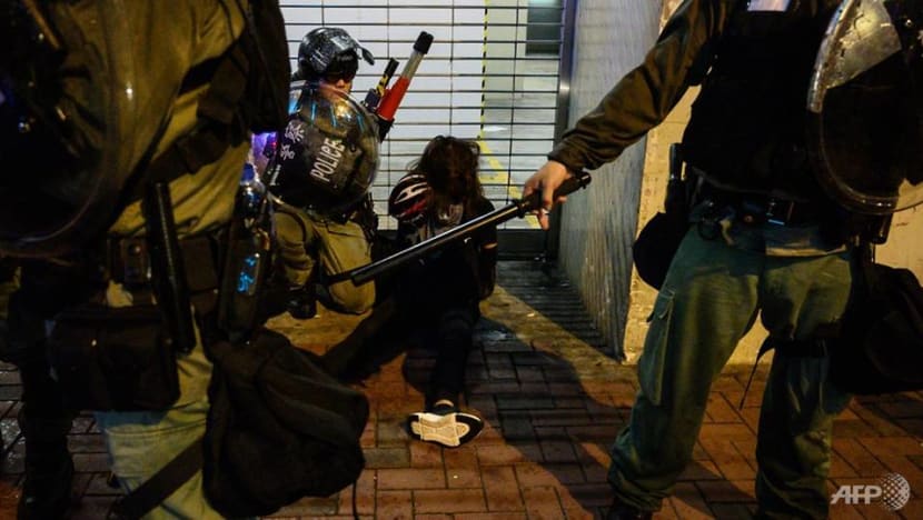 Hong Kong police arrest 36, youngest aged 12, after running battles with protesters Hong Kong police arrest 36, youngest aged 12, after running battles with protesters