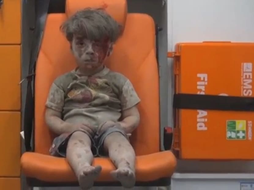Gallery: Haunting image of Syrian boy rescued from Aleppo rubble