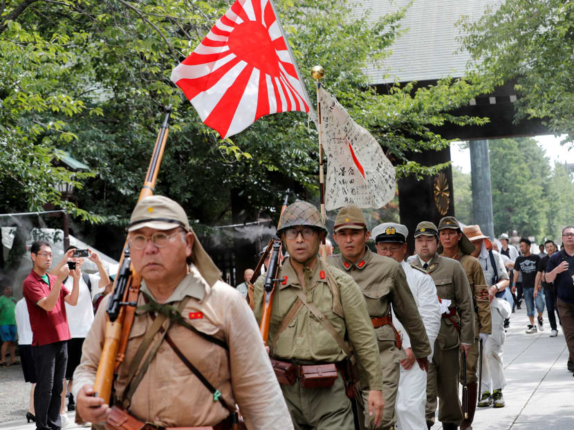 Photo of the day: Men wearing the Japanese imperial military uniform visit the Yasukuni Shrine in Tokyo on Aug 15, 2019, the 74th anniversary of Japan's surrender in World War Two.