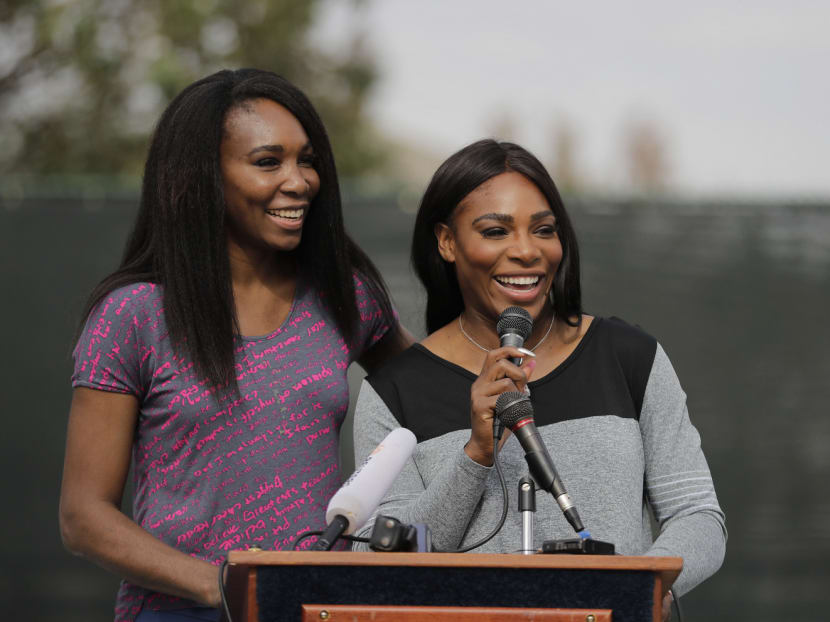 Sister Venus and Serena Williams speak during a dedication ceremony of the Leuders Park tennis courts on Saturday, Nov. 12, 2016, in Compton, California. The courts were dedicated in their name. Photo: AP