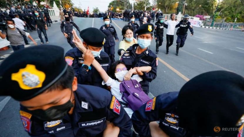 Thai police vow more arrests after nearly 100 protesters detained