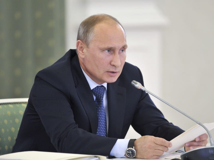 Russia's President Vladimir Putin chairs a meeting on fuel, energy and environment safety issues. Photo: Reuters/The Kremlin