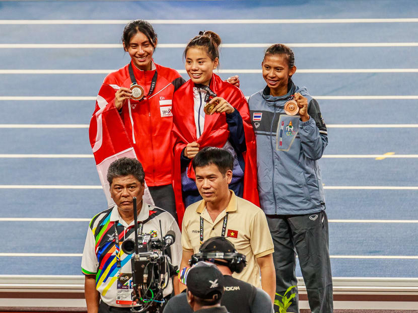 Winning the 400m hurdles silver was as good as gold for Dipna Lim-Prasad (left) on Tuesday. Photos: Sport Singapore/Stanley Cheah and Calvin Teoh
