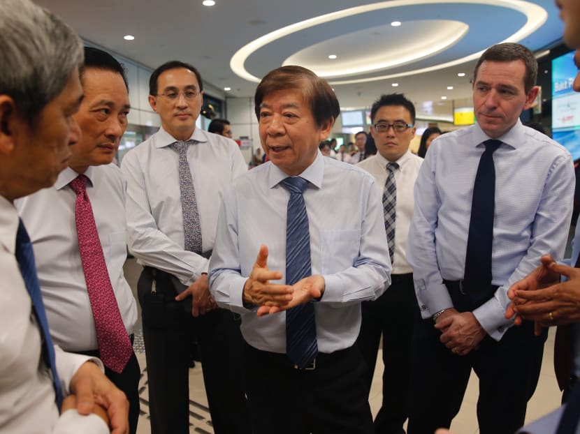 Transport Minister Khaw Boon Wan (front row, third from left) is seen here during a signing ceremony between the Land Transport Authority and Bombadier (Singapore) for the Bukit Panjang Light Rail Transit renewal work on March 23, 2018. 