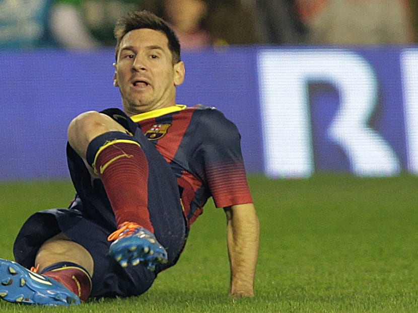 Barcelona's Lionel Messi suffered a tear in his left hamstring during their La Liga match at Betis’ Benito Villamarin stadium in Seville on Nov 10, 2013. Photo: AP