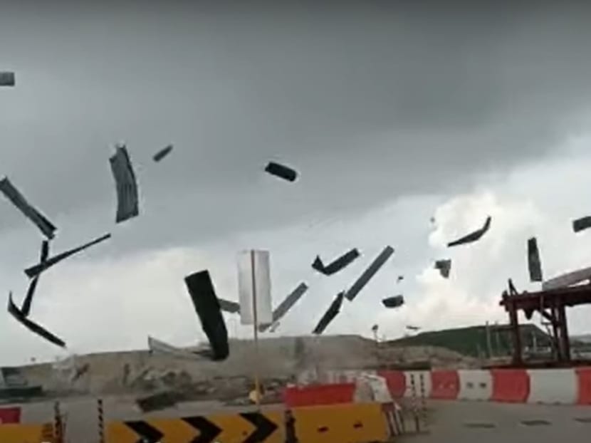 A screengrab from a video clip, showing debris flying in the air at the Changi East construction site on April 30, 2023.
