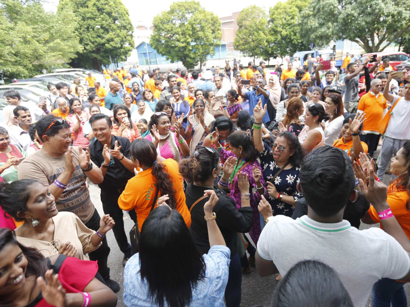 Former residents of the Pasir Panjang Power Station joining in the Bhangra dance on May 28, 2017. Photo: Najeer Yusof/TODAY