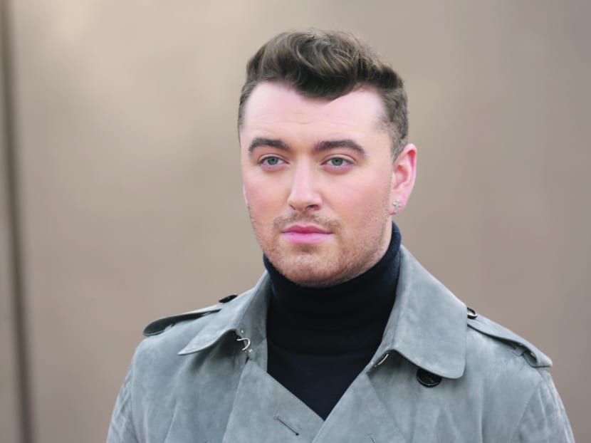 FILE - In a Monday, Feb. 23, 2015 file photo, singer Sam Smith arrives for the Burberry Womenswear Autumn/Winter 2015 show at London Fashion Week in Kensington Gardens, west London. Billboard announced Tuesday, April 14, 2015, that Smith, Nick Jonas and Hozier will take the stage at the Billboard Music Awards on on May 17. (Photo by Joel Ryan/Invision/AP, File)