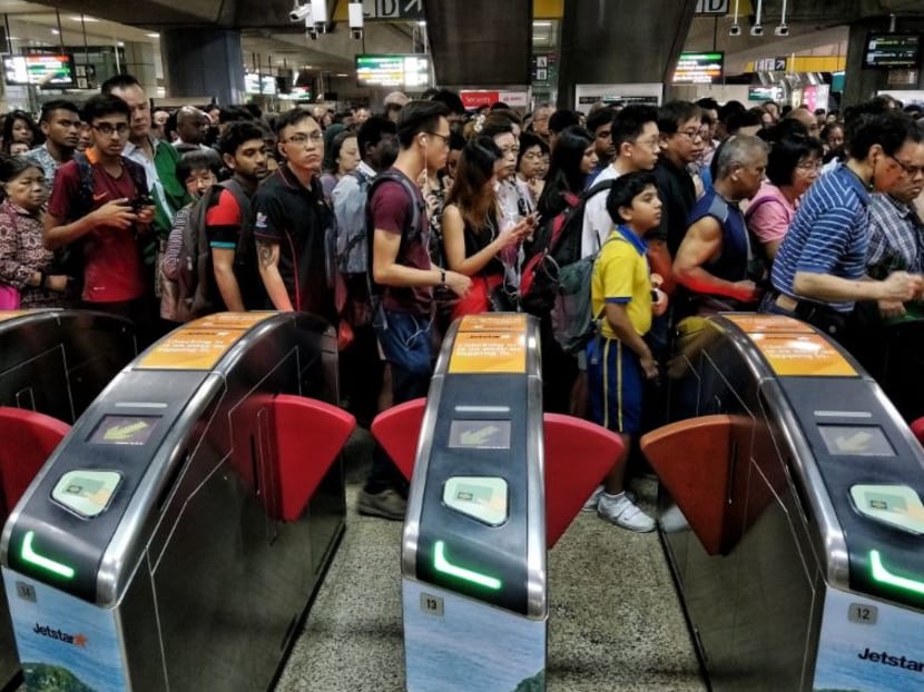 Commuters at Jurong East MRT station on Wednesday (Sept 19) morning. Train services had to be stopped between Clementi and Jurong East stations to allow SMRT staff to check on the track point fault.