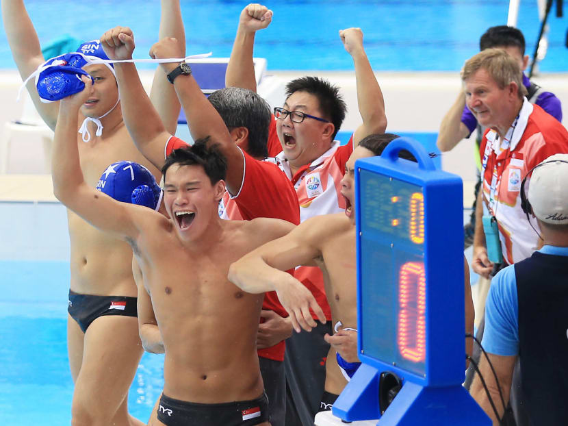 The Singapore men's water polo team celebrates after winning the gold medal at 28th SEA Games. Photo: Wee Teck Hian/TODAY