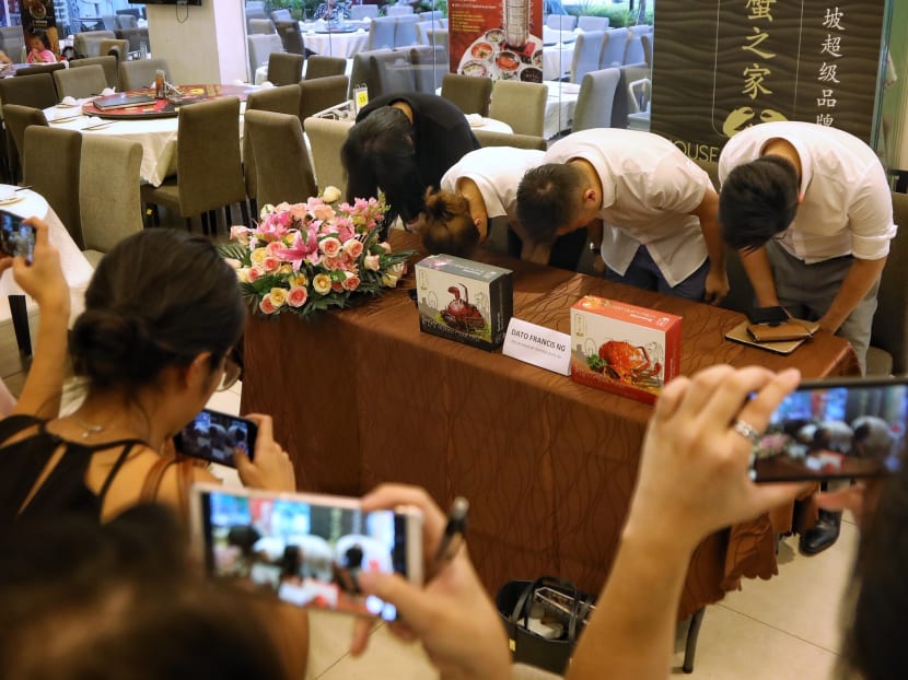 The House of Seafood management team at a press conference on Oct 25, 2019, apologising for putting live crabs in a claw machine.