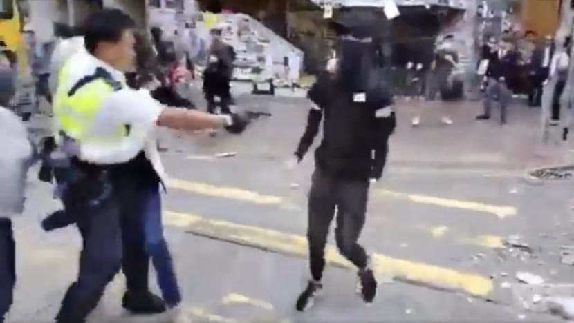 Hong Kong spirals into rare working-hour violence as police shoot protester Hong Kong spirals into rare working-hour violence as police shoot protester