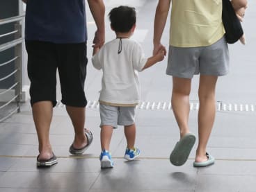 A child seen with his parents at Ang Mo Kio on Feb 13, 2022.