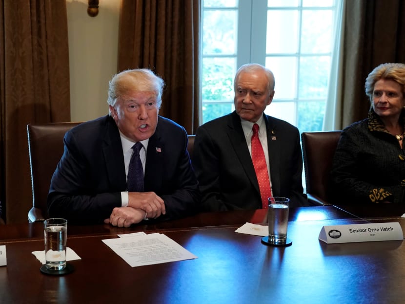 US President Donald Trump speaking during a meeting with members of the Senate Finance Committee at the White House in Washington on Oct 18, 2017. Mr Trump angrily disputed claims that he had disrespected the family of a slain soldier in a call to the soldier's wife. Photo: Reuters