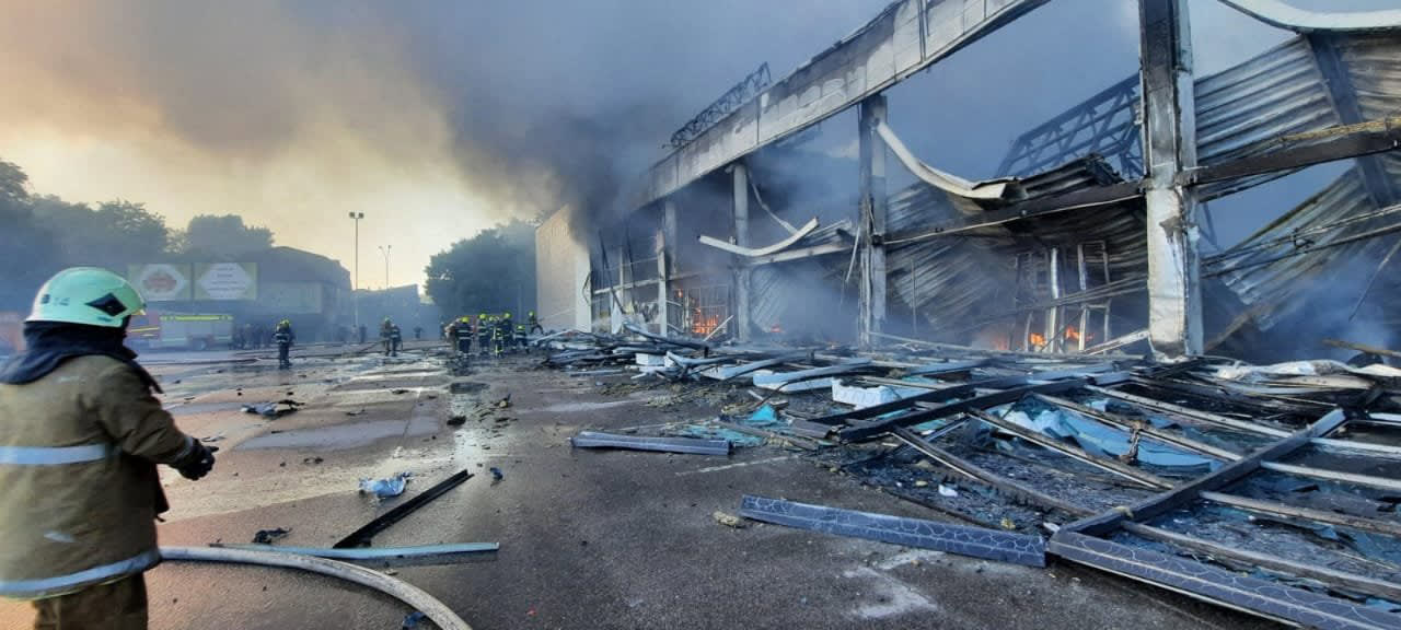 Handout picture taken and released by the Ukraine's State Emergency Service on June 27, 2022 shows firefighters putting out the fire in a mall hit by a Russian missile strike. Handout picture taken and released by the Ukraine's State Emergency Service on June 27, 2022 shows firefighters putting out the fire in a mall hit by a Russian missile strike.