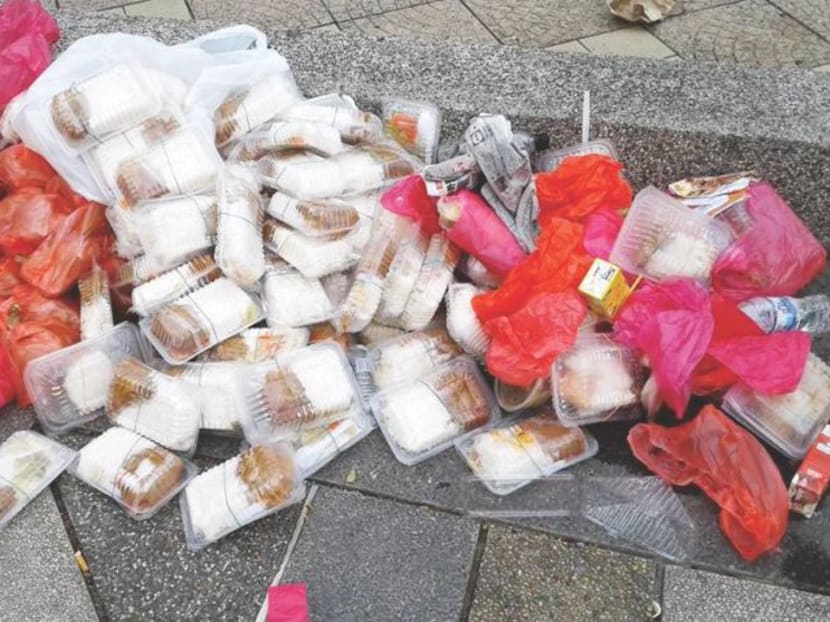 The area surrounding the National Mosque was littered on Saturday morning with boxes of food believed to be left over from a feeding programme. Photo: Ahmad Husni/Facebook via Malay Mail Online