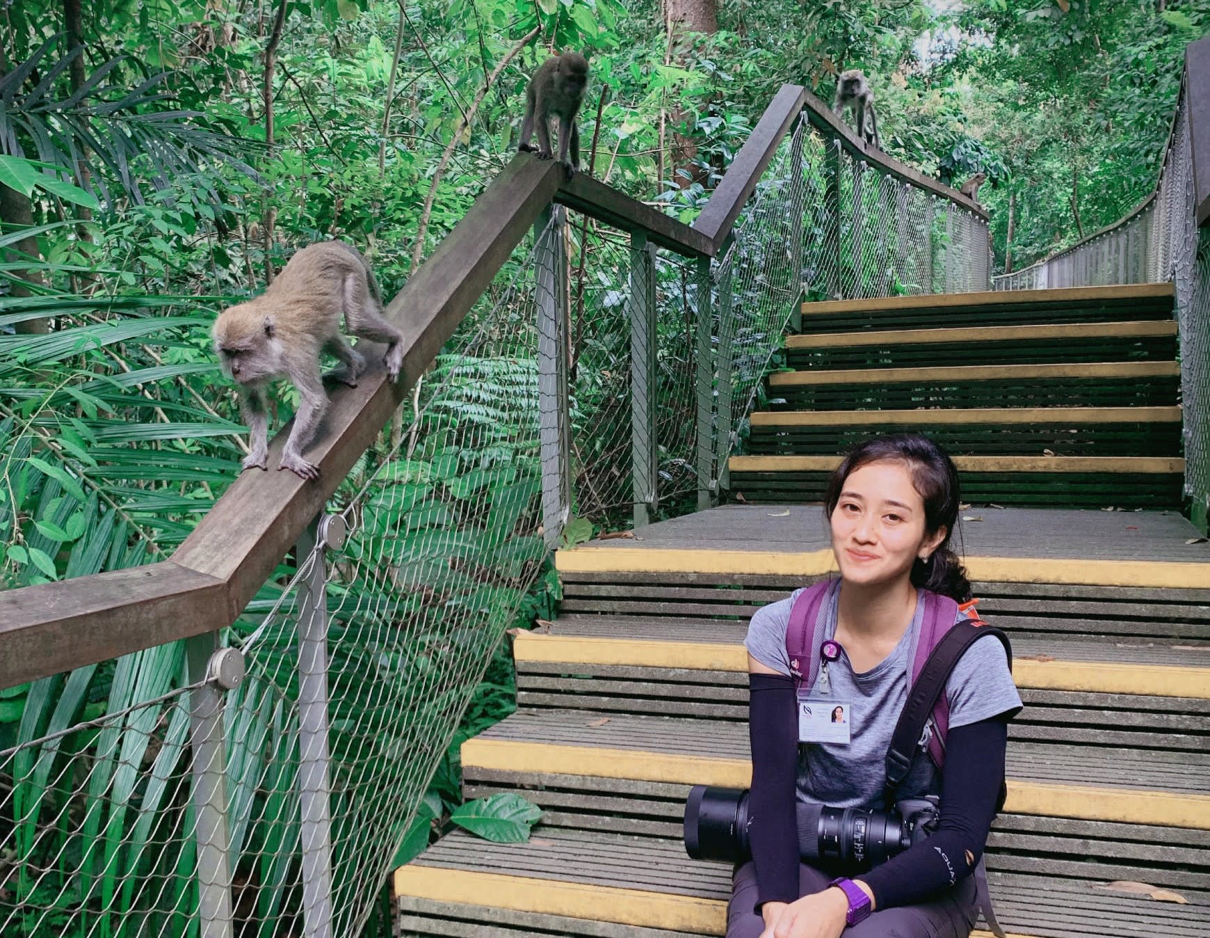 The author with long-tailed macaques at Windsor Nature Park in 2019.