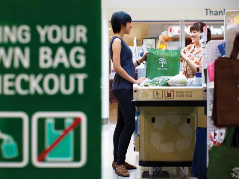 A month-long trial at selected NTUC FairPrice outlets will see shoppers having to pay for plastic bags.