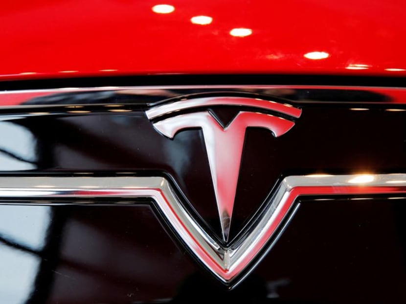 A Tesla logo on a Model S car.