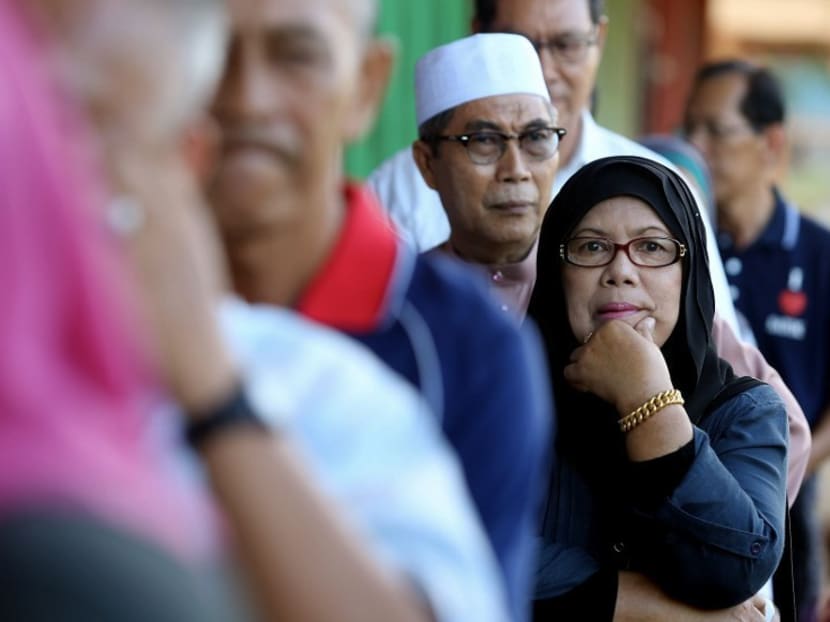 A Malaysian woman waits in the queue to cast her vote at a polling station in Kuching on May 7, 2016. Photo: AFP