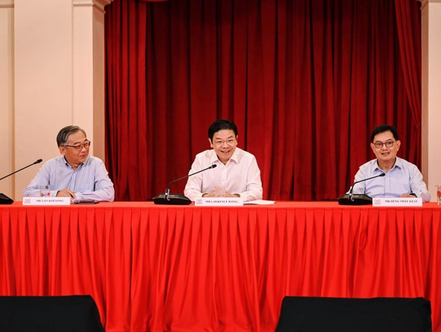 Prime Minister-designate Lawrence Wong (centre), flanked by his chosen deputies Gan Kim Yong (left) and Heng Swee Keat, at a press conference to announce his new Cabinet line-up on May 13, 2024.