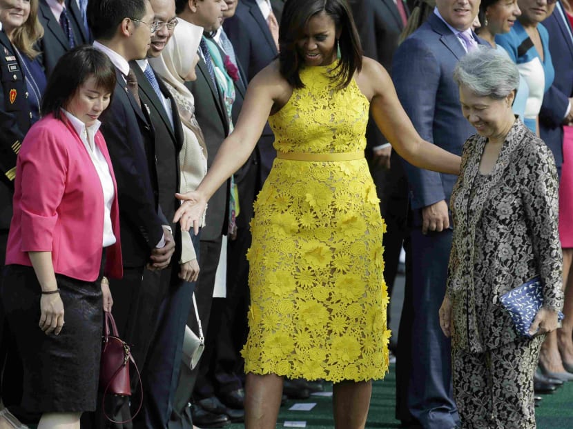 US First Lady Michelle Obama and PM Lee Hsien Loong's wife Mdm Ho Ching attend an official arrival ceremony on the South Lawn of the White House in Washington, US, on Aug 2, 2016. Photo: Reuters