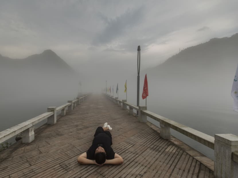 Luo Huazhong, who popularised the idea of adopting a more relaxed approach to life, taking a break in Jiande, China, June 18, 2021. Young people in China have set off a nascent counterculture movement that involves lying down and doing as little as possible.