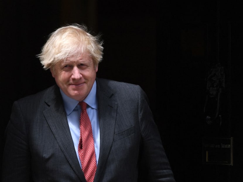 Britain's Prime Minister Boris Johnson walks out of 10 Downing Street in London on June 24, 2021.
