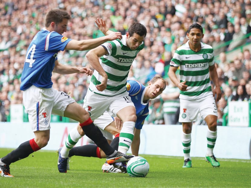 Without the Old Firm Rangers v Celtic clashes in the SPL, its TV ratings plummeted to 1.4 million viewers for the first 21 games of the 2012-2013 edition in Britain. However, the merger of all professional leagues under the SPFL helped Scottish football turn a corner. PHOTO: GETTY IMAGES