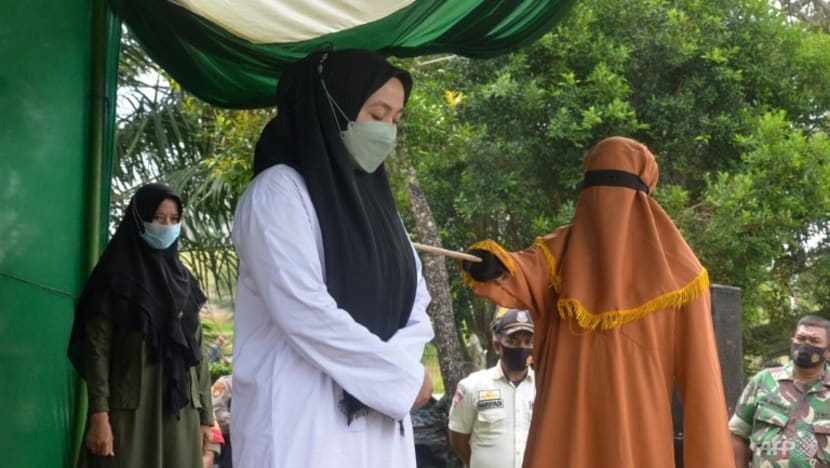 Indonesian woman flogged 100 times for adultery, partner gets 15 Indonesian woman flogged 100 times for adultery, partner gets 15