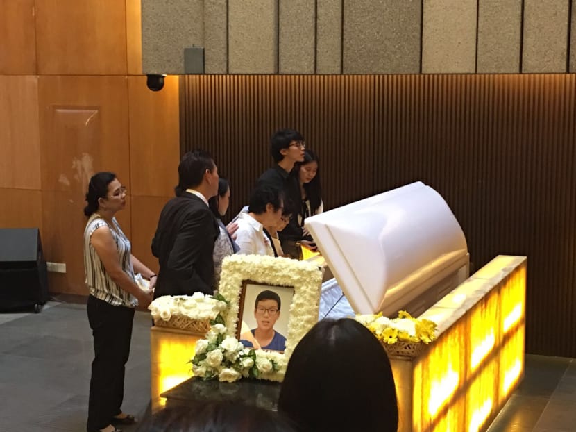 Family and friends gather at the  Mandai Crematorium to bid their final farewell to Benjamin Sim, the teenager who died suddenly after a 2.4km run in school. Photo: Syed Ebrahim/TODAY