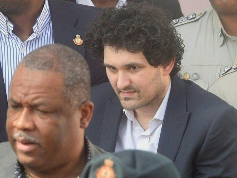 FTX founder Sam Bankman-Fried (centre) is led away handcuffed by officers of the Royal Bahamas Police Force at the Nassau, Bahamas, courthouse on Dec 19, 2022.
FTX founder Sam Bankman-Fried (centre) is led away handcuffed by officers of the Royal Bahamas Police Force at the Nassau, Bahamas, courthouse on Dec 19, 2022.