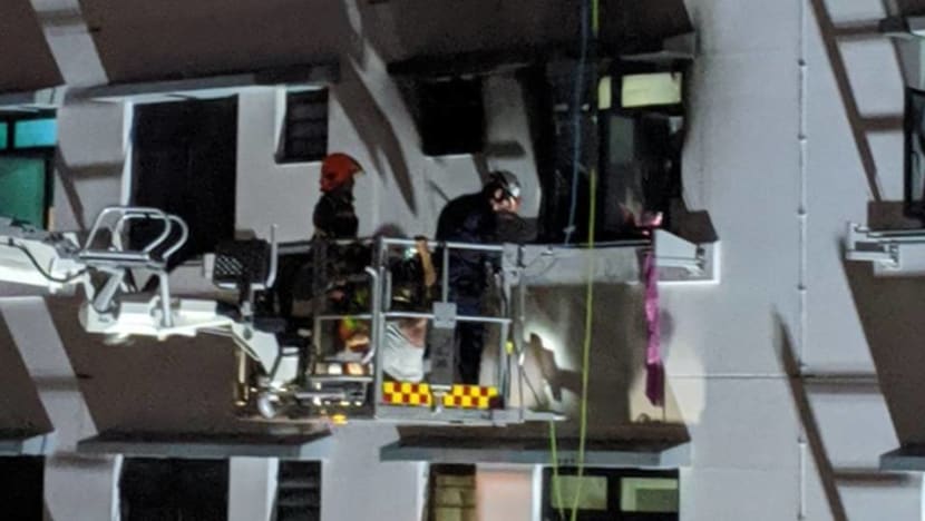 Firefighters rescue 2 people standing on ledge outside window after fire breaks out in Bukit Batok flat Firefighters rescue 2 people standing on ledge outside window after fire breaks out in Bukit Batok flat