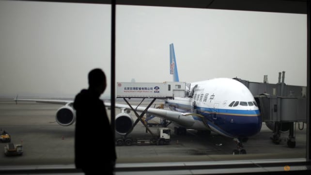 China shortens suspensions for international flights linked to COVID-19 cases