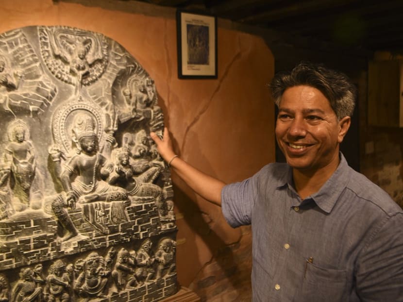 This picture taken on June 23, 2021 shows heritage expert Rabindra Puri gesturing during an interview with AFP at his house, in Bhaktapur some 12km east of Kathmandu.