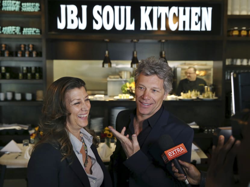 Rock star and philanthropist Jon Bon Jovi and his wife, Dorothea Hurley stand in Jon Bon Jovi Soul Foundation's Soul Kitchen during a grand opening for the B.E.A.T. Center, which stands for Bringing Everyone All Together on May 10, 2016 in Toms River, N.J. Photo: AP